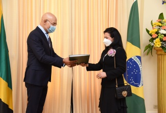 Governor-General, His Excellency the Most Hon. Sir Patrick Allen (left), receives letters of credence from Ambassador-designate of the Federative Republic of Brazil, Elza Moreira Marcelino de Castro, at King’s House on Friday (October 15).

 