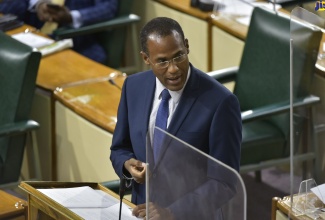 Minister of Finance and the Public Service, Dr. the Hon. Nigel Clarke, speaks in the debate on the first Supplementary Estimates of Expenditure for the 2021/22 fiscal year, in the House of Representatives on Tuesday (October 12). 