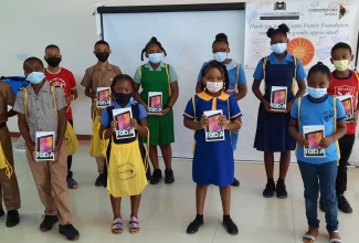 Students from schools in Hanover and Westmoreland display their  new tablets at a handing over ceremony at Travellers Beach Resort in Negril on September 25. More than 400 tablets valued at US$40,000 were issued to students under the Cornerstone Connex Programme to facilitate online learning.

