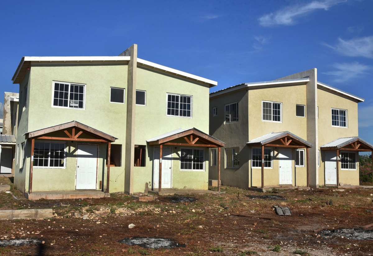 Houses are under construction as part of the Foreshore Estate development in Delacree Pen, St Andrew.