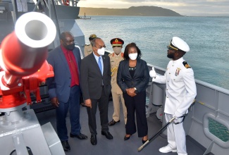 National Security Minister, the Hon. Dr. Horace Chang (second left) and wife of the Governor-General, Her Excellency the Most Hon. Lady Allen (second right) is given a description of the capabilities of Her Majesty’s Jamaican Ship (HMJS) Alexander Bustamante by Commanding Officer, Lieutenant Senior Grade Lt (sg) Marlon Marcos McHugh. Also pictured are Permanent Secretary in the Ministry of National Security Courtney Williams (left) and Chief of Defence Staff, JDF, Lieutenant General Rocky Meade. The occasion was the naming and commissioning ceremony of the HMJS Alexander Bustamante. It was held at HMJS CAGWAY, Port Royal on Thursday (December 30). It is the latest addition to the Jamaica Defence Force (JDF) fleet. It will deploy as part of the 2nd District JDF CG fleet. It arrived at HMJS CAGWAY on August 5, 2021. The ceremony also featured the naming of the HMJS Samuel Sharpe and HMJS George William Gordon.  Photo: Yhomo Hutchinson 

