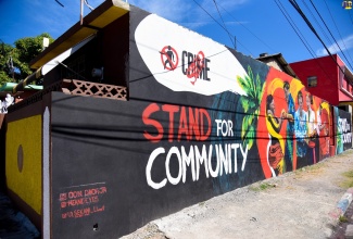 The ‘Stand Up For Our Country’ mural, which was unveiled in Hannah Town, Kingston, recently. The augmented reality (AR) artwork, done by Bonito Thompson, is part of a Crime Stop project, aimed at urging Jamaicans to stand together against crime.