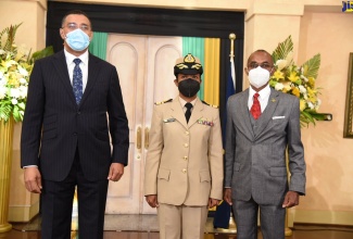 Prime Minister and Minister of Defence, the Most Hon. Andrew Holness (left), and retired Chief of Defence Staff (CDS), Lieutenant General Rocky Meade (right), with newly appointed CDS, Rear Admiral Antonette Wemyss-Gorman, following Thursday’s (January 20) swearing- in ceremony at King’s House.