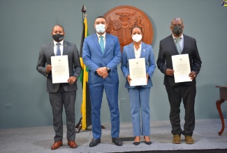 Prime Minister, the Most Hon. Andrew Holness (second left), with newly appointed Ministers and State Minister,  following a virtual swearing-in ceremony on Tuesday (January 11). They are (from left) Minister without Portfolio in the Office of the Prime Minister, Hon. Floyd Green; Former Attorney-General and now Minister of the newly created Ministry of Legal and Constitutional Affairs, Hon. Marlene Malahoo Forte; and Minister of State in the Ministry of Agriculture and Fisheries, Hon. Franklin Witter.