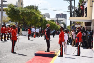 Governor-General, His Excellency the Most Hon. Sir Patrick Allen (centre), stands at attention for the playing of the National Anthem, at the 2022/23 ceremonial opening of Parliament at Gordon House on Thursday (February 10).

