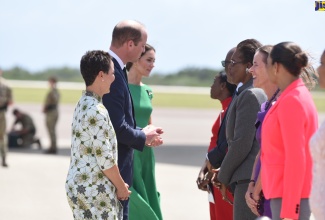 Their Royal Highnesses, the Duke and Duchess of Cambridge (pictured second and third left, respectively), are introduced to a team of dignitaries by Minister of Foreign Affairs and Foreign Trade, Senator the Hon. Kamina Johnson Smith (left). The officials had gathered at the tarmac of the Norman Manley International Airport on Thursday (March 24) to officially bid the Royal couple farewell. They are (from fourth left), Opposition Senator, Sophia Frazer Binns; State Minister in the Ministry of Foreign Affairs and Foreign Trade, Senator the Hon. Leslie Campbell (partially hidden); Permanent Secretary in the Ministry of Foreign Affairs and Foreign Trade, Ambassador Sheila Monteith; British High Commissioner, Her Excellency Judith Slater; and the Governor-General’s secretary, Claudine Heaven. Their Royal Highnesses were in the island for a three-day Official Visit which formed part of celebrations to mark the 70th Anniversary (Platinum Jubilee) of the Coronation of Her Majesty The Queen.