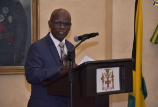 Deputy Governor-General (Ag), Custos Rotulorum for the parish of Kingston, Hon. Steadman Fuller, reads Her Majesty The Queen’s Commonwealth Day 2022 message during a commemorative ceremony held at King's House. Commonwealth Day was celebrated on March 14 under the theme ‘Delivering A Common Future’. It celebrates the commonwealth countries' united efforts to achieve common goals. These include protecting natural resources, boosting trade, and working towards a peaceful, prosperous, and more sustainable future.  