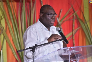 Author of the book, ‘How Trade Liberalisation Affects a Sugar-Dependent Community in Jamaica’, Dr. Donovan Stanberry, reads an excerpt during its official launch, held at the University of the West Indies, Mona Campus, on March 16. 