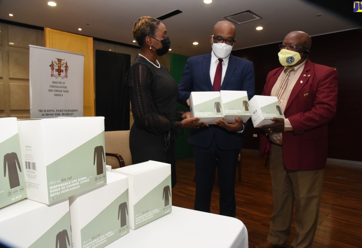 PHOTOS: 156,000 Isolation Gowns Donated To Ministry Of Health