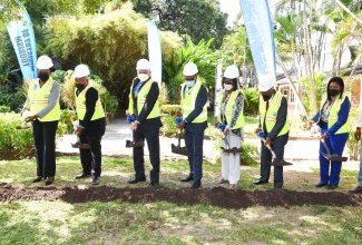 Minister of Tourism, Hon. Edmund Bartlett (fourth left), participates in breaking ground for a $70-million development project to improve the aesthetics of the Devon House courtyard, during a ceremony on Thursday (March 17). Also participating (from left) are Permanent Secretary in the Ministry of Tourism, Jennifer Griffith; Deputy Mayor of Kingston and St. Andrew, Councillor Winston Ennis; Minister of Justice and Member of Parliament for St. Andrew North East, Hon. Delroy Chuck; Chairman of the Devon House Development Company, Minion Jean Wright; Chairman of the Tourism Enhancement Fund (TEF), Godfrey Dyer; and Executive Director of Devon House, Mureen James.