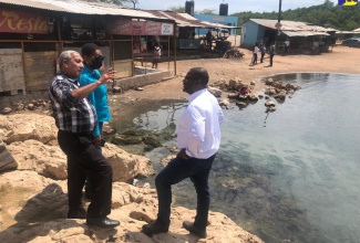 Mayor of May Pen, His Worship Councillor Winston Maragh (centre) in conversation with Executive Director, Tourism Product Development Company (TPDCo), Wade Mars (right) and Corporate Communications and Community Awareness Coordinator, TPDCo, Marline Stephenson Dalley (left), during a tour of the Salt River Mineral Spa in Clarendon on Friday (March 4). 