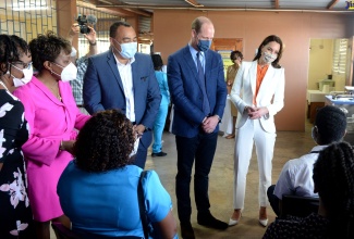 Their Royal Highnesses, the Duke and Duchess of Cambridge (second right and right, respectively), interact with staff members at the Spanish Town Hospital, during a visit to the health facility on Wednesday, March 23.  With them are Minister of Health and Wellness, Dr. the Hon. Hon. Christopher Tufton (centre); CEO of the hospital, Jacqueline Ellis (left) and Senior Medical Officer at the hospital,  Dr. Jacqueline Wright-James.  