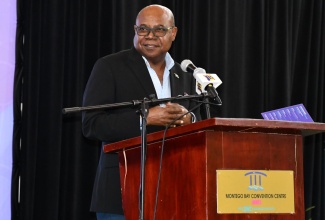 Minister of Tourism, Hon. Edmund Bartlett, addresses the opening ceremony of the seventh annual tourism speed networking event, which was held at the Montego Bay Convention Centre in St. James on Thursday (March 31).