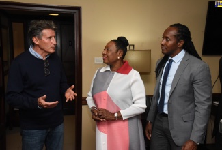 Minister of Culture, Gender, Entertainment and Sport, Hon. Olivia Grange (centre), shares in conversation with International Association of Athletics Federations (IAAF) President, Lord Sebastian Coe (left) after his arrival at the Norman Manley International Airport in Kingston on April 15. Looking on is State Minister in the Ministry of Culture, Gender, Entertainment and Sport, Hon. Alando Terrelonge.

 