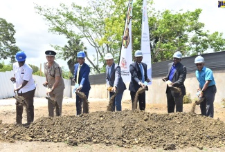 Prime Minister, the Most Hon. Andrew Holness (fourth left), officially breaks ground for the construction of the new Little London Police Station, in Westmoreland, on Thursday (April 7) . Also taking part are (from left): Minister of Local Government and Rural Development, Hon. Desmond McKenzie; Deputy Commissioner of Police, Clifford Blake; Member of Parliament for Western Westmoreland, Moreland Wilson; Minister of State in the Ministry of National Security, Zavia Mayne; Permanent Secretary in the Ministry of National Security, Courtney Williams; and Senior General Manager, Construction and Development, at the National Housing Trust (NHT), Donald Moore. 
 
