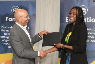 Governor-General, His Excellency, the Most Hon. Sir Patrick Allen (left), presents ‘I Believe Initiative’ (IBI) Ambassador, Chevelle Campbell, with a certificate of appreciation during the Governor-General’s Programme for Excellence Annual General Meeting held on May 1 at The Jamaica Pegasus hotel in Kingston.  The GGPE was established in 2014 to give cohesiveness to programmes that are affiliated to the Office of the Governor-General – the Governor-General’s Achievement Awards (GGAA) and the I Believe initiative (IBI). 