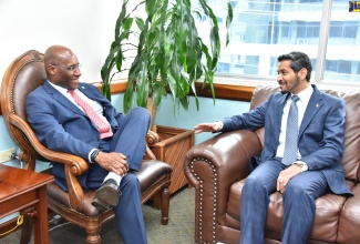 Minister of Industry, Investment and Commerce, Senator the Hon. Aubyn Hill (left), engages in conversation with Ambassador of the Kingdom of Saudi Arabia to Jamaica, His Excellency Faisal Falah Alharbi, during a courtesy call at the Ministry’s building in Kingston on May 11.

 