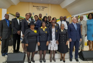 Minister of Justice, Hon. Delroy Chuck (right, front row), and Custos of St. Catherine, Hon. Icylin Golding (second right, front row), with executive members of the St. Catherine Justices of the Peace (JP) Association, during the recent launch of the group,  held at the Family of God Seventh-day Adventist Church in Spanish Town, in the parish. 