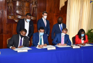 rime Minister, the Most Hon. Andrew Holness (seated second left); Minister Without Portfolio in the Office of the Prime Minister (OPM), Hon. Floyd Green (seated left); Chief Executive Officer of Fujitsu Caribbean and Latin America,  Mervyn Eyre (seated second right), and Permanent Secretary in the Office of the Prime Minister (OPM) and Ministry of Economic Growth and Job Creation,  Audrey Sewell (seated right), sign a contract for the digitisation of public records under the National Identification System (NIDS), at the OPM on Friday  (May 6). Observing in the background (standing from left) are: Chief Executive Officer of the Registrar General’s Department (RGD), Charlton McFarlane; Modernization of State Specialist, Inter-American Development Bank, Benjamin Roseth; and Programme Director for NIDS, Dr. Warren Vernon.