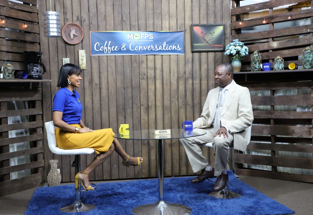 Technical Specialist in the Taxation Policy Division, Ministry of Finance and the Public Service, Cebert Mitchell (left), speaks with host Shakiel Rochester Shorter, on the Ministry’s Coffee and Conversations series.

