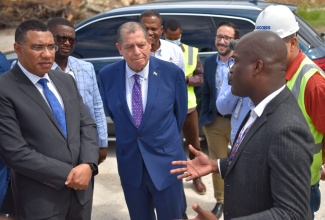 Prime Minister the Most Hon. Andrew Holness (left), listens keenly to the comments of Chief Executive Officer of MBJ Airports Limited, Shane Munro (right), during a tour of the Sangster International Airport in Montego Bay, St. James on May 13. Looking on (from second left) are Member of Parliament for Central St. James, Heroy Clarke, and Minister of Transport and Mining, Hon. Audley Shaw.