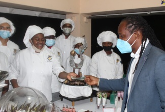 Minister of State in the Ministry of Culture, Gender, Entertainment & Sport, Hon. Alando Terrelonge, seen here interacting with local chefs at a recent Culinary Arts and Gastronomy Symposium at the Cardiff Hotel & Spa, Runaway Bay, St. Ann.  