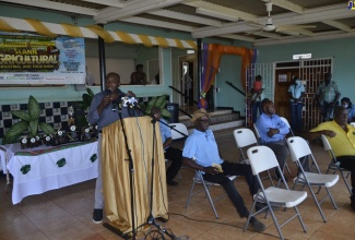 Minister of Agriculture and Fisheries, Hon. Pearnel Charles Jr. (left),  speaks at the eighth staging of the St. Ann Agricultural, Industrial and Food Show at Port Rhoades Sports Club in Discovery Bay, St. Ann, on May 26.