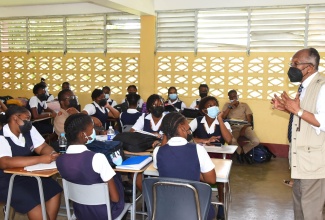 Chairman of the Jamaica Education Transformation Commission (JETC), Professor Orlando Patterson, addresses students at Dinthill Technical High School in St. Catherine, during a visit to the institution on June 6.
R. Fraser Photos

