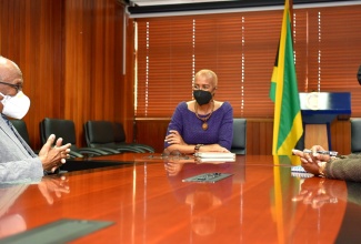 Minister of Education and Youth, Hon. Fayval Williams (centre) and Acting Chief Education Officer in the Ministry, Dr. Kasan Troupe (right) engage in discussion with Chairman of the Jamaica Education Transformation Commission (JETC), Professor Orlando Patterson, during a courtesy call at the Ministry in Kingston on Wednesday (June 1). 