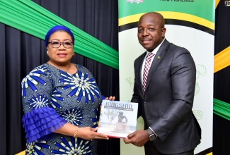 Minister of Agriculture and Fisheries, Hon. Pearnel Charles Jr., presents a publication, titled ‘Kingston: A Treasure of the Caribbean’, to High Commissioner of the Federal Republic of Nigeria to Jamaica, Her Excellency Dr. Maureen Piribonemi Tamuno, during the diplomat’s courtesy call at the Ministry’s offices, at Hope Gardens in St. Andrew, on Thursday (July 28).