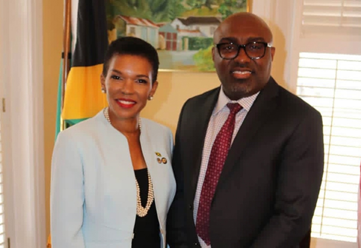 Jamaica’s Ambassador to Washington, Her Excellency Audrey Marks shares a light moment with Pumpstation Entertainment Manager Omar Stephenson, one of the organisers of the DC World Reggae Festival at its launch at the Embassy of Jamaica. 