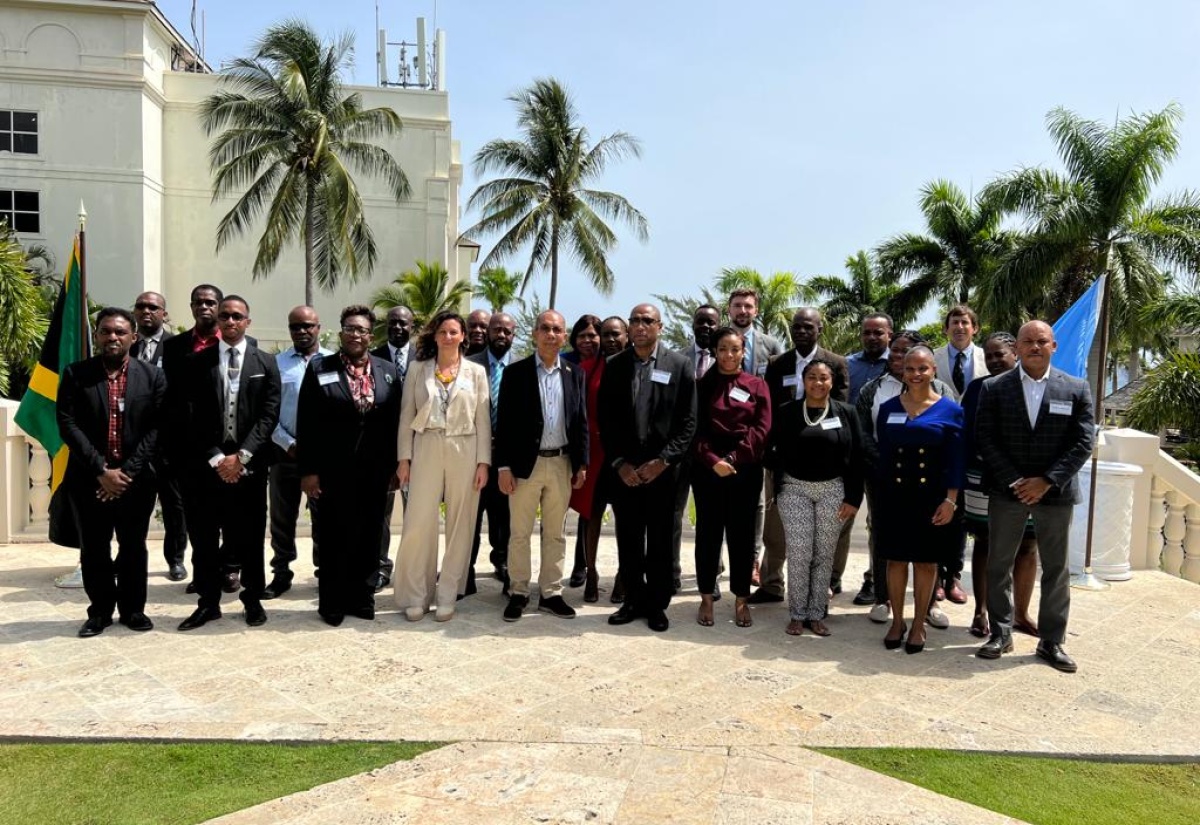 Deputy Prime Minister and Minister of National Security, Hon. Dr. Horace Chang (fifth left, front row), with members of the technical working group developing the country’s national organised crime strategy, at the launch of the three-day technical workshop on Tuesday (July 12) in Montego Bay.