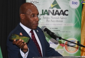 Minister of Industry, Investment and Commerce, Senator the Hon. Aubyn Hill, addresses the Jamaica National Accreditation Agency’s (JANAAC) United States Food and Drug Administration (FDA) Accredited Third-Party Certification Programme certificate semi-virtual presentation ceremony on Tuesday (July 19). The event was held at The Jamaica Pegasus hotel in New Kingston. JANAAC is an agency of the Ministry.  