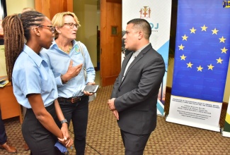 Minister without Portfolio in the Ministry of Economic Growth and Job Creation, Senator the Hon. Matthew Samuda (right), in discussion with Chairman, White River Fish Sanctuary and Marine Association, Belinda Collier Morrow (centre) and Sanctuary Manager, White River Marine Association and Fish Sanctuary, Reanne McKenzie, during the official launch of the project dubbed ‘A Jamaican Path from Hills to Ocean’ at the University of the West Indies (UWI) Regional Headquarters, Mona, on July 19.
 
