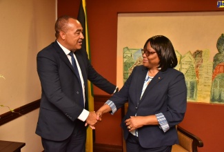 Minister of Health and Wellness, Dr. the Hon. Christopher Tufton (left), greets Director of the Pan American Health Organisation (PAHO), Dr. Carissa F. Etienne,  following her arrival on July 26 at the Norman Manley International Airport in Kingston. Dr. Etienne will engage in a series of events hosted by the Ministry, until Friday, July 29 when she departs. 