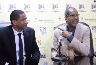 Chief Executive Officer at the National Fisheries Authority (NFA), Dr. Gavin Bellamy (right), speaks at a  JIS ‘Think Tank’, today (July 21). Listening is Senior Director of Research in the Aquaculture Branch at the NFA, Mr. DeHaan Brown.