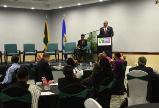 Minister of Tourism, Hon. Edmund Bartlett, speaking on day one of the inaugural Organization of American States (OAS) high-level policy forum on building the resilience of Small and Medium Tourism Enterprises (SMTEs) in the Caribbean to Disasters at the Holiday Inn Resort in Montego Bay, St. James, on Wednesday (July 20). 