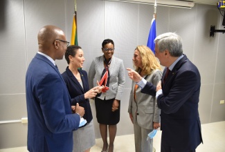 Minister of Foreign Affairs and Foreign Trade, Senator the Hon. Kamina Johnson Smith (second left), in discussion with co-Heads of the European Delegation, Myriam Ferran (second right) and Javier Niño Pérez (right), at the sixth Jamaica-European Union Political Dialogue, held at the Ministry, downtown Kingston, today (July 20). With the Minister are  Permanent Secretary in the Ministry, Ambassador Sheila Monteith and  Permanent Secretary in the Ministry of Health and Wellness, Dunstan Bryan.