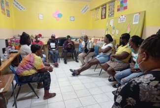 Case managers from The Ministry of National Security engaged a group of parents in a sensitisation session at Dupont Primary & Infant School for the 25 Schools Strategy.  