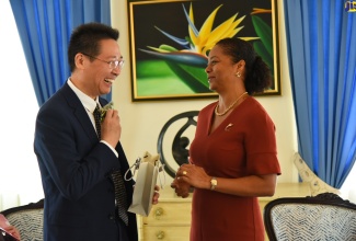 Minister of Legal and Constitutional Affairs, Marlene Malahoo Forte, shares in light conversation with Ambassador of the People’s Republic of China to Jamaica, His Excellency Chen Dao Jiang, during a recent courtesy call at Jamaica House.