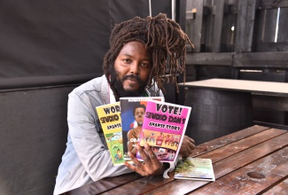 Author, Danijah Taylor, displays some of the Afrocentric and Jamaican books he has written. The social entrepreneur, who operates the Studio Dan production house, encourages young Jamaicans through his ‘penpowerment’ movement.