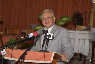 Justice Minister, Hon. Delroy Chuck, addresses the commissioning ceremony for 40 Justices of the Peace in St. Thomas on Thursday (July 21) at the Yallahs Baptist Church.   