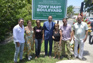  Prime Minister, the Most Hon. Andrew Holness (centre) and Minister of Legal and Constitutional Affairs, Hon. Marlene Malahoo Forte (third from left),  join family members of late businessman, Anthony 'Tony' Hart, at the ceremony for the renaming of Southern Cross Boulevard to Anthony Hart Boulevard on Saturday (August 20). Family members (l-r) are Mart, Wendy, Sheila, Blaise and Bruce Hart.

 