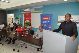 Minister without Portfolio in the Office of the Prime Minister, Hon. Floyd Green, addresses the recent Transport Operators Development Sustainable Services (TODSS) Blue Ribbon First Responders Presentation Ceremony, at the University of Technology, Jamaica. Also participating in the event are (from left) Information Communications Technology Manager at the Transport Authority, Vernon Walters; Head of the Public Safety and Traffic Enforcement Branch (PSTEB), Assistant Commissioner of Police Gary McKenzie; President of the United Independent Congress (UIC), Joseph Patterson; Chief Operating Officer, British Caribbean Insurance Company, Michelle Anderson and Minister of Transport and Mining, Hon. Audley Shaw.     

