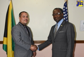 Minister without Portfolio in the Ministry of Economic Growth and Job Creation, Senator the Hon. Matthew Samuda (left), greets United States Ambassador to Jamaica, His Excellency Nick Perry, during a courtesy call by the Ambassador, at the Ministry in Kingston on July 28. 