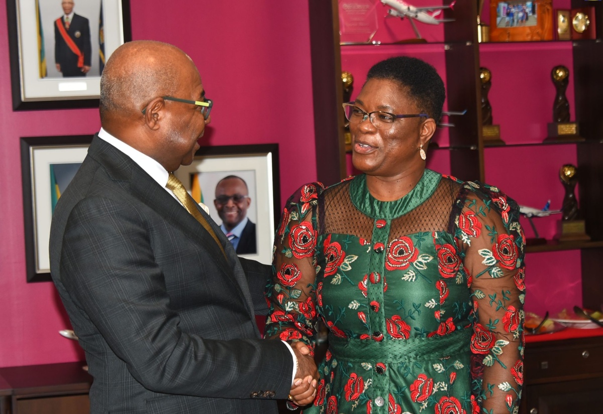 Tourism Minister, Hon. Edmund Bartlett, shakes the hand of the Republic of Namibia’s Minister for Presidential Affairs, Hon. Christine Hoebes, following a meeting at the Ministry’s offices in New Kingston, on Friday (August 5).