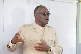 Custos of Manchester, Garfield Green, addresses students at a school reopening event at the May Day High School in the parish on September 12.