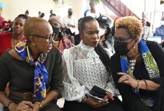 Minister of Education and Youth, Hon. Fayval Williams (left), speaks with Acting Permanent Secretary in the Ministry, Maureen Dwyer (right), during the Jamaica Teachers’ Association (JTA) church service held at the Tarrant Baptist Church in Kingston recently. Looking on is Acting Chief Education Officer (Acting) in the Ministry, Dr. Kasan Troupe.