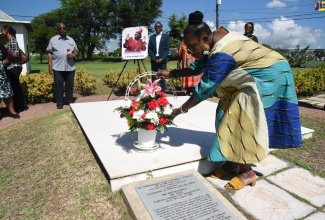 Culture, Gender, Entertainment and Sport Minister, Hon. Olivia Grange, lays a floral arrangement on the grave of renowned cultural icon, Dr. the Hon. Louise Bennett-Coverley (“Miss Lou”), at National Heroes Park in Kingston, on September 7. The ceremony is one of several commemorative activities celebrating the l03rd anniversary of her birth. Born September 7, 1919, Miss Lou was a Jamaican folklorist, writer of poetry, songs, performer and educator. Dr. Bennett-Coverley is widely considered one of the most important purveyors of Jamaican culture. She died July 26, 2006.