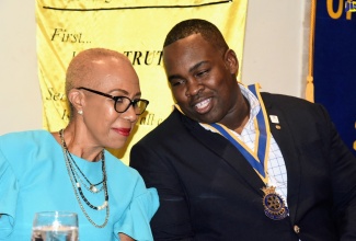 Minister of Education and Youth, Hon. Fayval Williams (left) is in conversation with President of the Rotary Club of Kingston, Karsten Johnson, during the club’s meeting on September 15 at the Pegasus Hotel, Kingston.